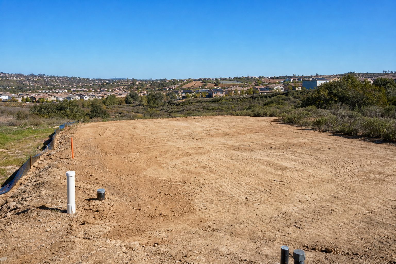 what does it actually cost to buy raw land in Otay Ranch San Diego in 2026 including grading permits utility hookups and development fees before I can build — image 2