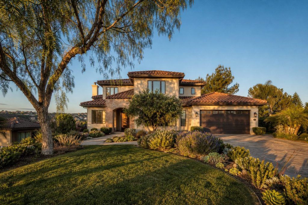 Two-story contemporary Mediterranean home with terra-cotta tile roof and mature pepper tree in Scripps Ranch, San Diego.